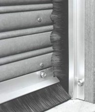 Brush door seals for rolling steel doors